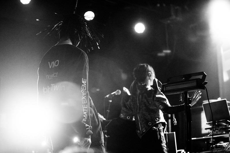 violent magic orchestra faces the back of the stage while performing at the sinclair